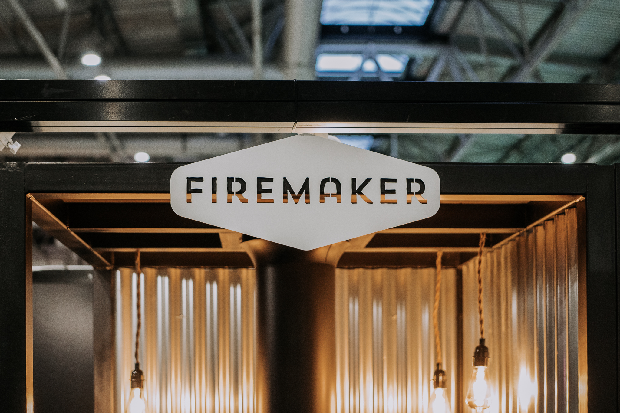 firemake logo on a background of edison lightbulbs