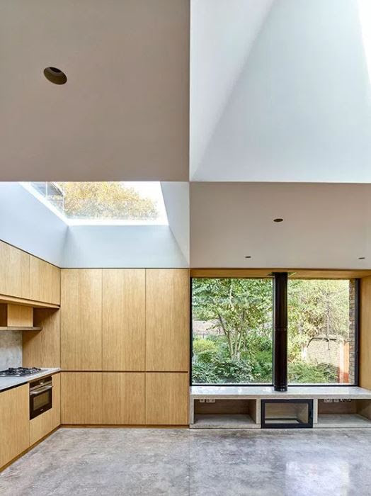 Contemporary interior. Calm, modern aesthetic. Fireplace by window.